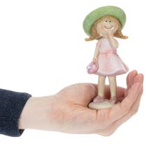 Itens Conjunto de 2 figuras decorativas de meninas com chapéus, nas cores rosa e verde, 6,5 x 5,5 x 14,5 cm.
