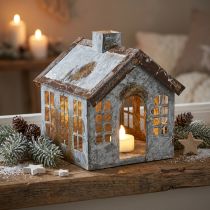 Itens Suporte metálico para vela tealight, em formato de casinha, com 14,5 cm de altura.