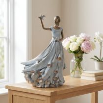 Itens Estatueta de uma mulher com um pássaro. Escultura decorativa artisticamente concebida para um design intemporal. 41 cm