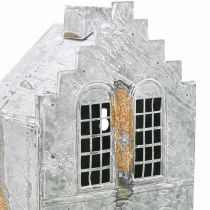 Itens Suporte metálico para vela tealight, em formato de casinha, com 25,5 cm de altura.