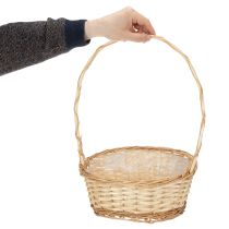 Itens Cesta de presente com aproximadamente 30 cm x 23 cm, em tom claro.
