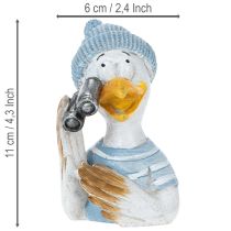 Itens Decoração náutica de mesa com gaivota, nas cores azul, branca e prateada, 11 cm de altura.