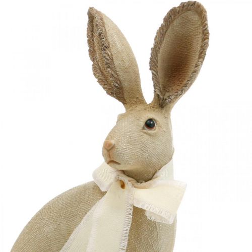 Floristik24 Coelhinho da Páscoa sentado com laço poliresina decoração de mesa Páscoa H30cm