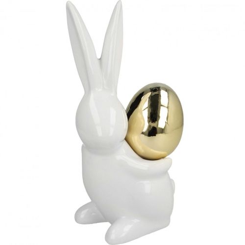 Floristik24 Coelhinhos de Páscoa elegantes, coelhinhos de cerâmica com ovo de ouro, decoração de Páscoa branco, dourado H18cm 2pcs