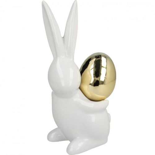 Floristik24 Coelhinhos da Páscoa elegantes, coelhinhos de cerâmica com ovo dourado, decoração de Páscoa branco, dourado Alt.18cm 2 unidades
