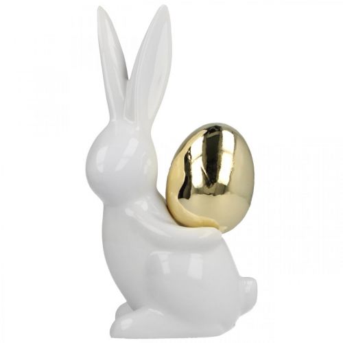 Floristik24 Coelhinhos da Páscoa elegantes, coelhinhos de cerâmica com ovo dourado, decoração de Páscoa branco, dourado Alt.18cm 2 unidades