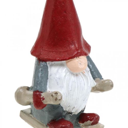Floristik24 Vela motivo duende de natal, decoração advento, duende com esquis, vela decorativa Alt.12cm