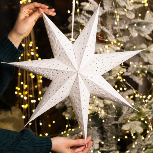 Itens Estrelas de papel para iluminar decorações natalinas festivas.