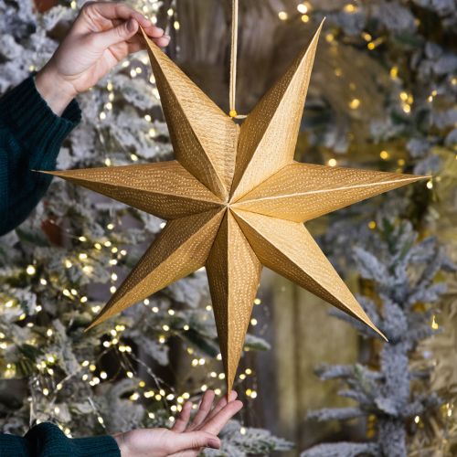 Itens Estrelas de papel festivas para decorações de Advento e Natal.