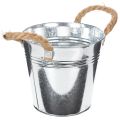 Balde de metal brilhante com