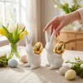 Coelhos com ovo de ouro, coelhos de cerâmica para Páscoa nobre branco, dourado H13cm 2pcs | Floristik24.pt