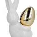 Floristik24 Coelhos com ovo de ouro, coelhos de cerâmica para Páscoa nobre branco, dourado H13cm 2pcs