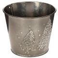 Vaso de metal com pinheiros